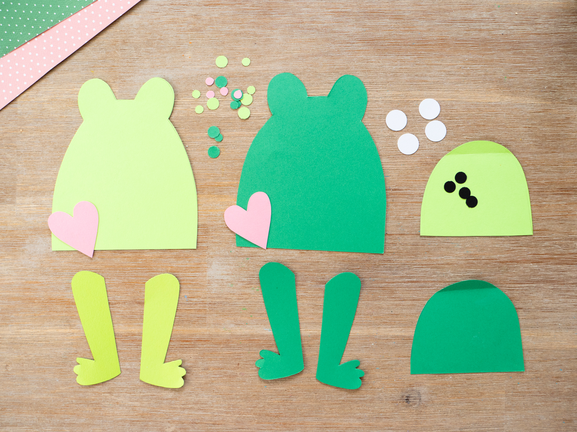 Kids cutting out pieces for a Mother&rsquo;s Day frog craft using a printable template
