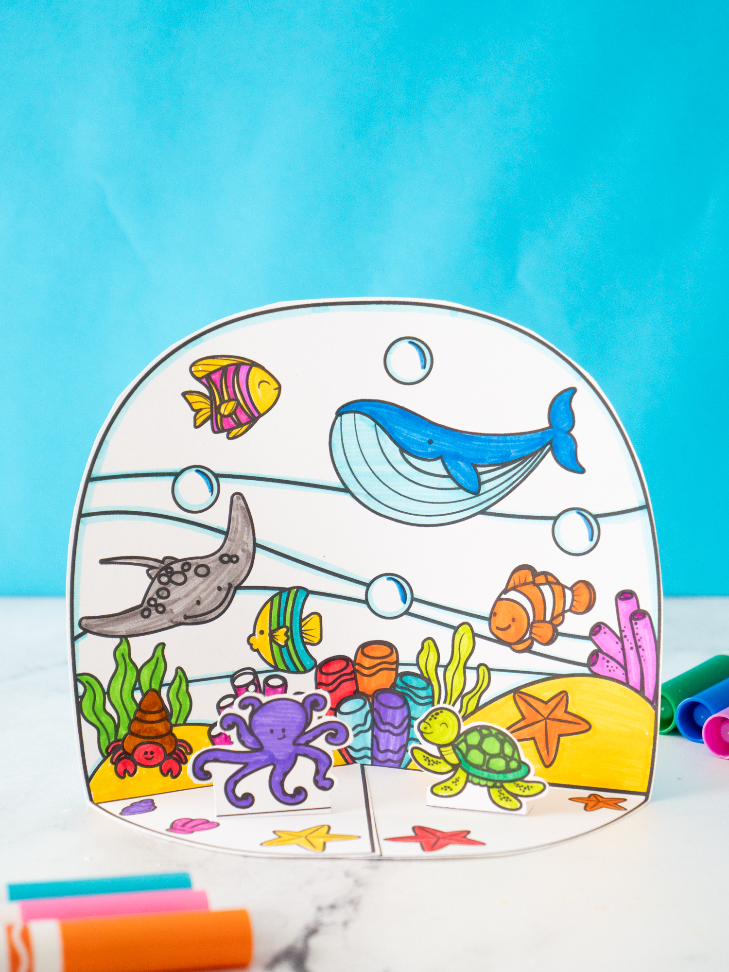 Printable Ocean Diorama for Kids with whales, fish, turtles, and other sea creatures ready to color and assemble.