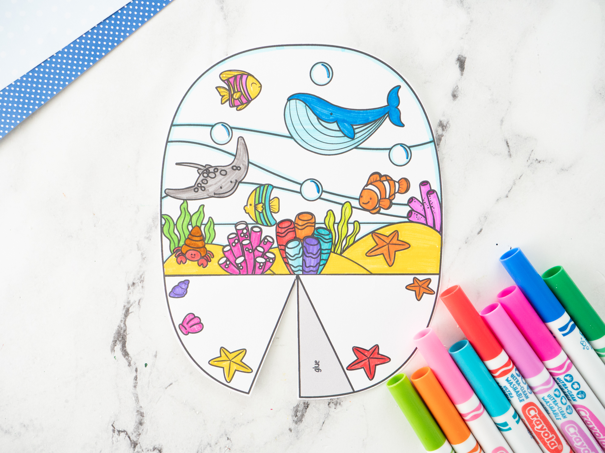 Color and cut out the printable Ocean Diorama for Kids and all of the ocean animal pieces.