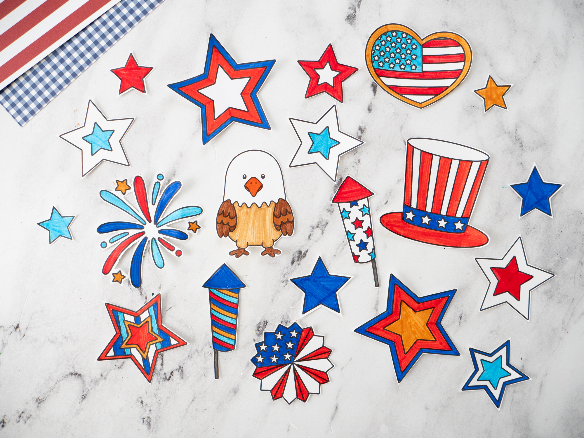 Cutting out printable Fourth of July wreath pieces after coloring